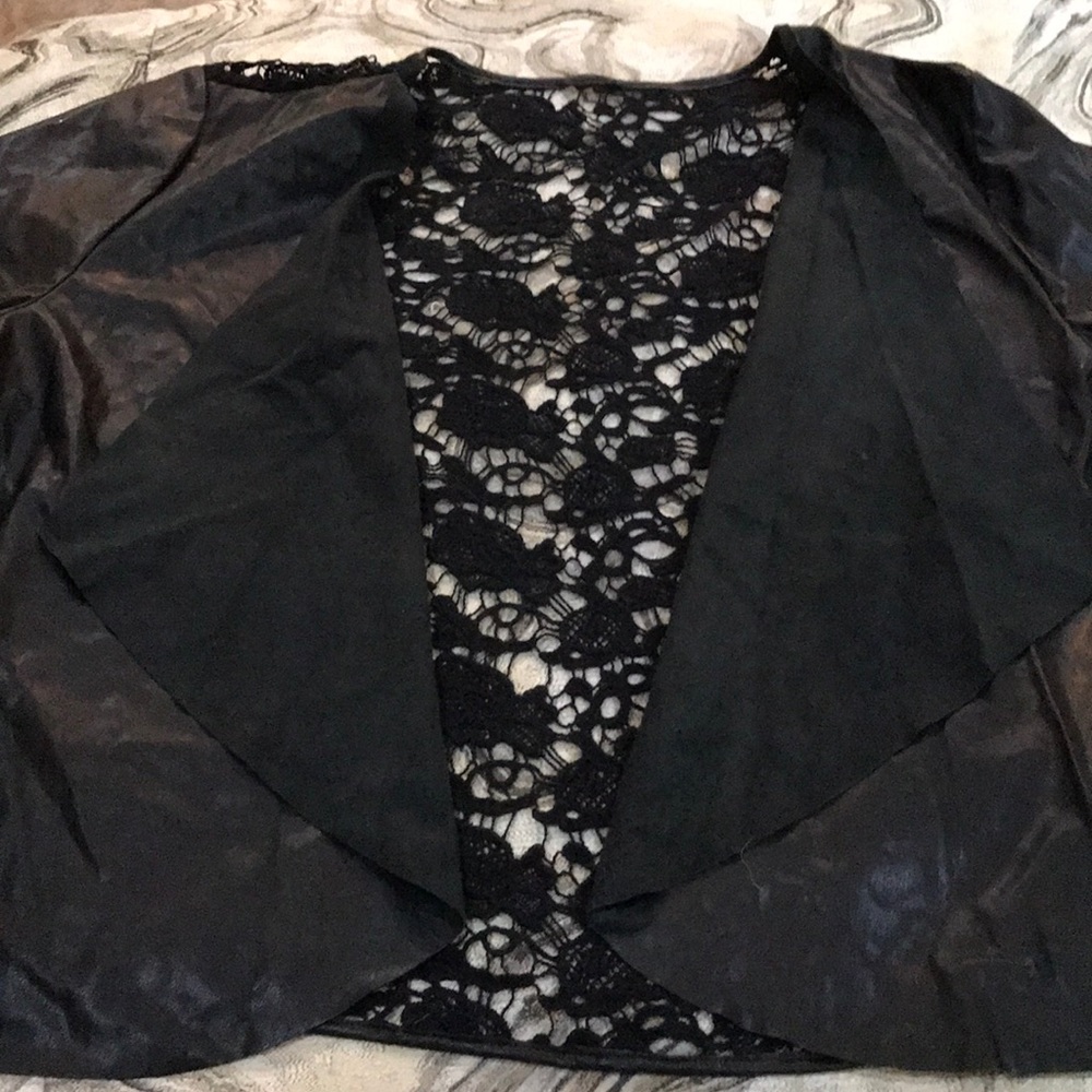 Faux leather jacket with lace back.